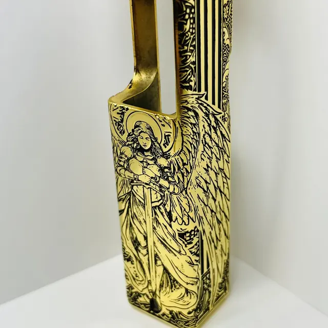 Gold-plated pistol slide hand engraved with an archangel figure