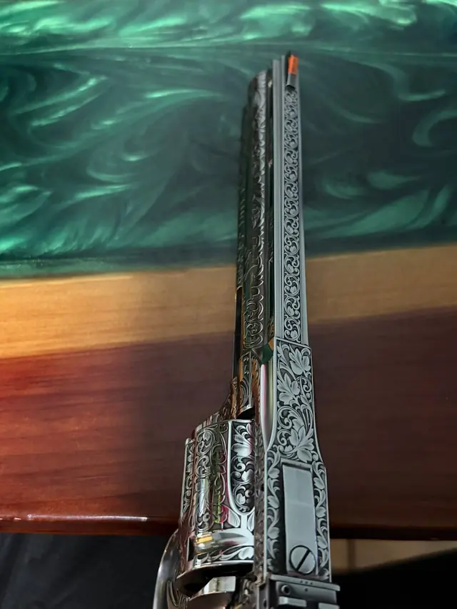 Detail view of an engraved revolver barrel