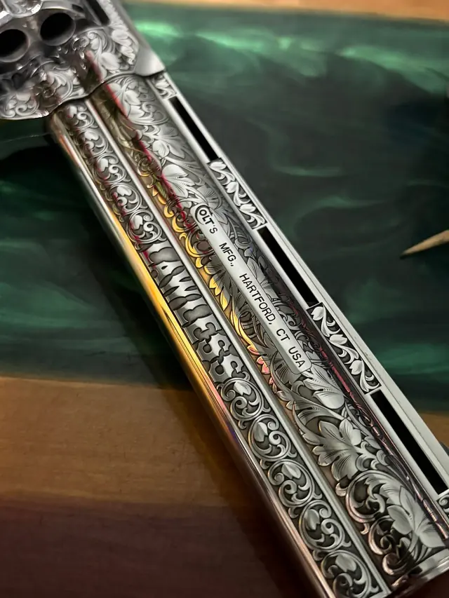 Engraved revolver frame with scroll pattern