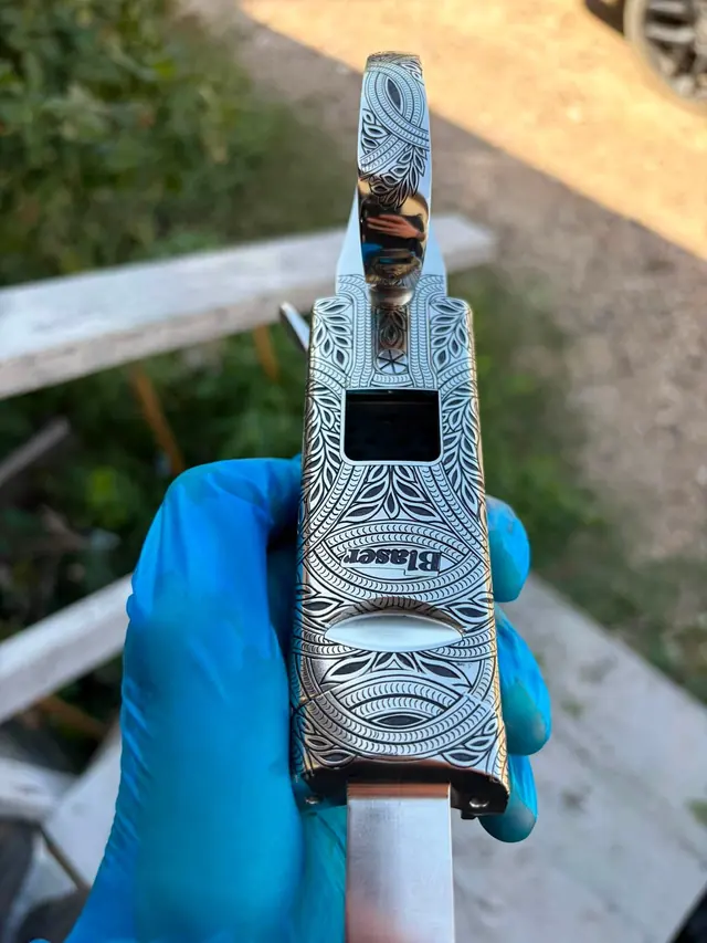 Engraved rifle action with floral scroll pattern